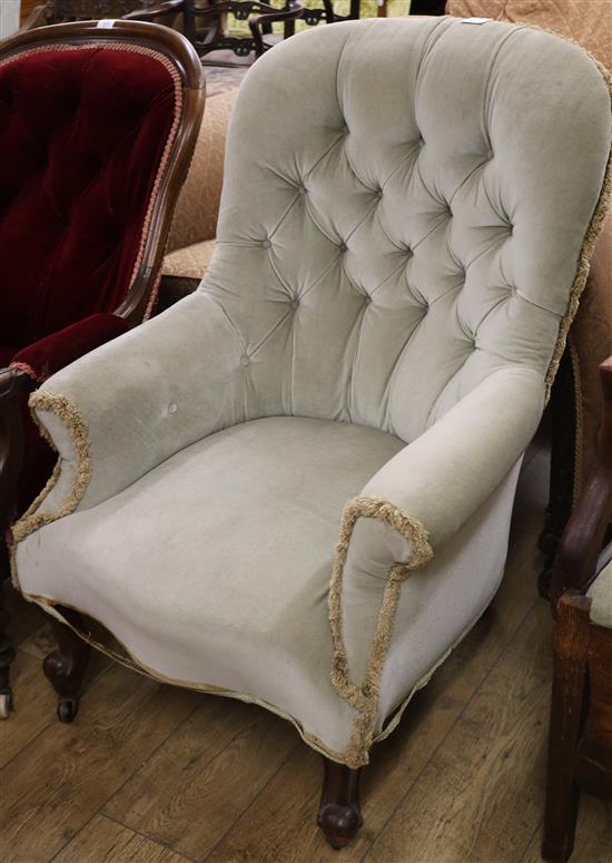 A Victorian buttonback armchair